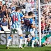 Blackpool goalkeeper Daniel Grimshaw makes a double save to deny Huddersfield Town's Yuta Nakayama a goal during the Sky Bet Championship match at the John Smith's Stadium, Huddersfield. (Picture: Tim Goode/PA Wire).