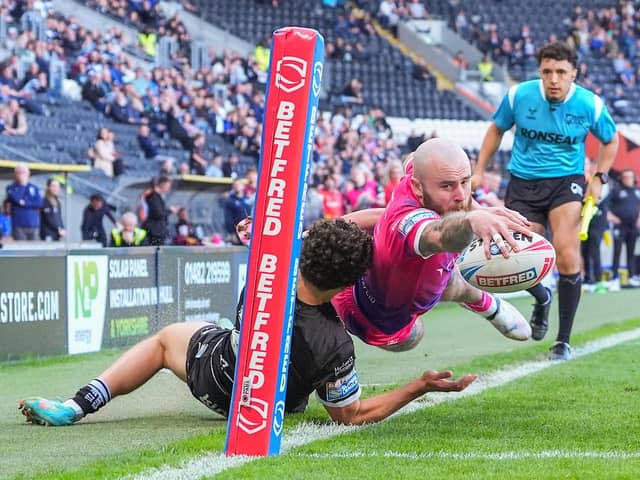 Picture by Olly Hassell/SWpix.com - 06/04/2024 - Rugby League - Betfred Super League Round 7 - Hull FC v Huddersfield Giants - MKM Stadium, Kingston upon Hull, England - Jake Bibby of Huddersfield grounds the ball for a try before the video referee disallows it for being in-touch