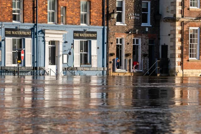 Rising flood water from the River Ouse, floods businesses and properties along King's Staith. PIC: James Hardisty