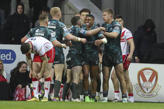 Huddersfield celebrate Kevin Naiqama's opening try. (Photo: Paul Currie/SWpix.com)