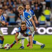COMABATIVE: Jonathan Hogg (left) in action for Huddersfield Town against Burnley