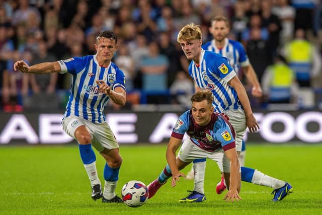 COMABATIVE: Jonathan Hogg (left) in action for Huddersfield Town against Burnley