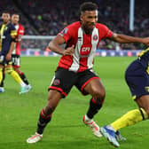 DISAPPOINTMENT: Auston Trusty challenges Antoine Semenyo during Sheffield United's 3-0 defeat to Bournemouth