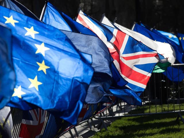 European Union flags and a British flag. PIC: PA
