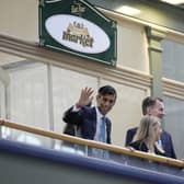 Prime Minister Rishi Sunak (left), Sara Britcliffe MP and Chancellor Jeremy Hunt (second right) during a community project visit to Accrington Market Hall in Lancashire, as a £2 billion investment in over 100 projects across the UK, through the levelling up fund has been announced. Picture date: Thursday January 19, 2023.