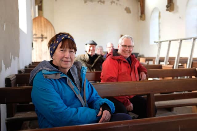 Trustees Heather Swettenham, Martin Booth, Ian Whinray, Rev Martin Fletcher and Annie Sumner on the pews to be turned into bunk beds