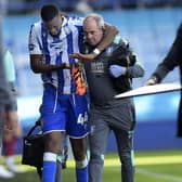 INJURED: Momo Diaby hobbles off as his Sheffield Wednesday debut is cut short