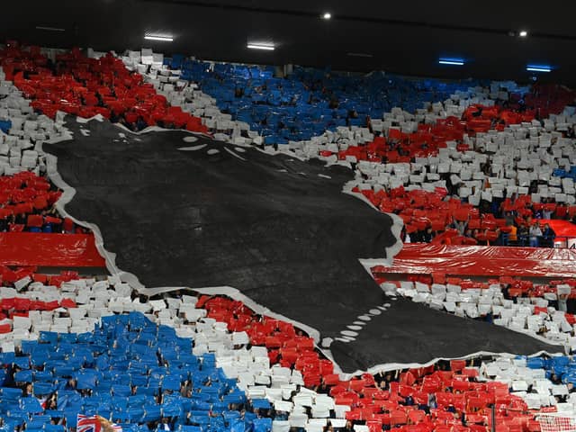 Rangers fans make a mural of the Union Jack to pay tribute to Her Majesty Queen Elizabeth II, who died away at Balmoral Castle on September 8 prior to the UEFA Champions League group A match between Rangers FC and SSC Napoli at Ibrox Stadium on September 14, 2022 in Glasgow, Scotland. Picture: Stu Forster/Getty Images.