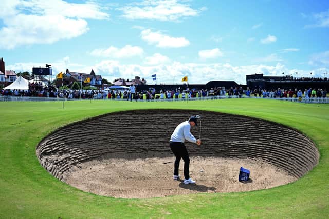 Northern Ireland's Rory McIlroy chips out of a bunker on the practice green ahead of 151st British Open Golf Championship at Royal Liverpool (Picture: PAUL ELLIS/AFP via Getty Images)