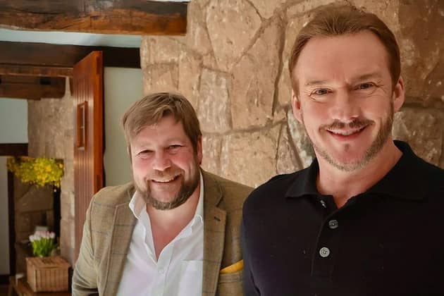 Singer Russell Watson with auctioneer Angus Ashworth. Picture: WBD/PA
