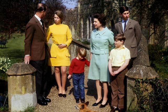 Queen Elizabeth II, Prince Charles, Prince Edward, Prince Andrew and Princess Anne listening to the Duke of Edinburgh on a bridge in the grounds of Frogmore, Windsor on 21st April 1968.