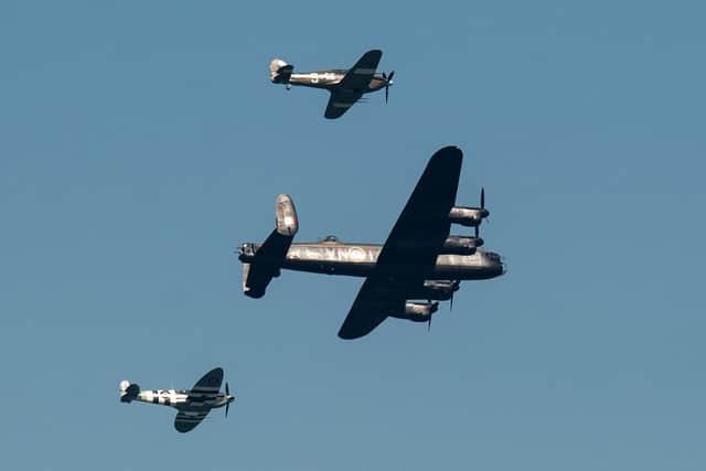 A Spitfire, hurricane and a Lancaster Bomber perform an aerobatic display during Armed Forces Day. (Pic credit: Oli Scarff / AFP via Getty Images)