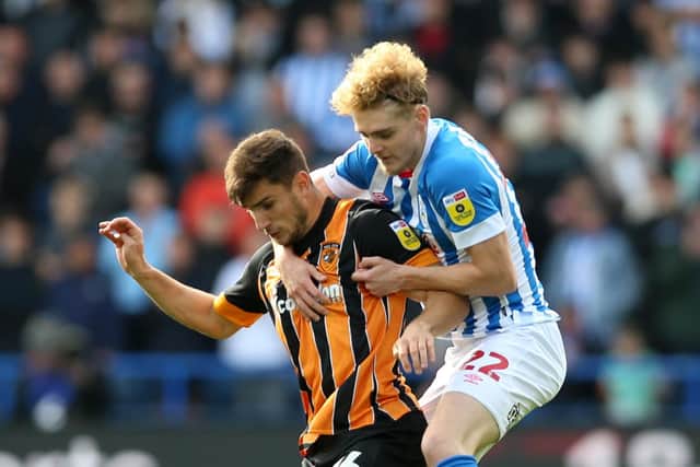 Hull City's Ryan Longman (left) and Huddersfield Town's Jack Rudoni in action (Picture: PA)