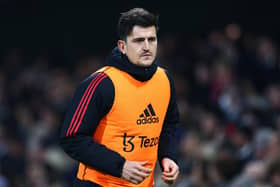 Harry Maguire of Manchester United warms up as a substitute on the touchline. (Picture: Clive Rose/Getty Images)