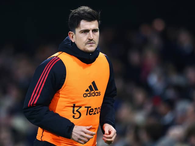 Harry Maguire of Manchester United warms up as a substitute on the touchline. (Picture: Clive Rose/Getty Images)
