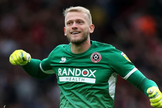 COMEBACK: Sheffield United goalkeeper Adam Davies - who would later save a late penalty - celebrates after team-mate Oli McBurnie scores their side's equaliser at Bramall Lane Picture: Barrington Coombs/PA
