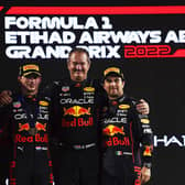 ABU DHABI, UNITED ARAB EMIRATES - NOVEMBER 20: Race winner Max Verstappen of the Netherlands and Oracle Red Bull Racing, second placed Charles Leclerc of Monaco and Ferrari, Olaf Janssen, Red Bull Racing Team Member and Third placed Sergio Perez of Mexico and Oracle Red Bull Racing celebrate on the podium during the F1 Grand Prix of Abu Dhabi at Yas Marina Circuit on November 20, 2022 in Abu Dhabi, United Arab Emirates. (Photo by Rudy Carezzevoli/Getty Images)
