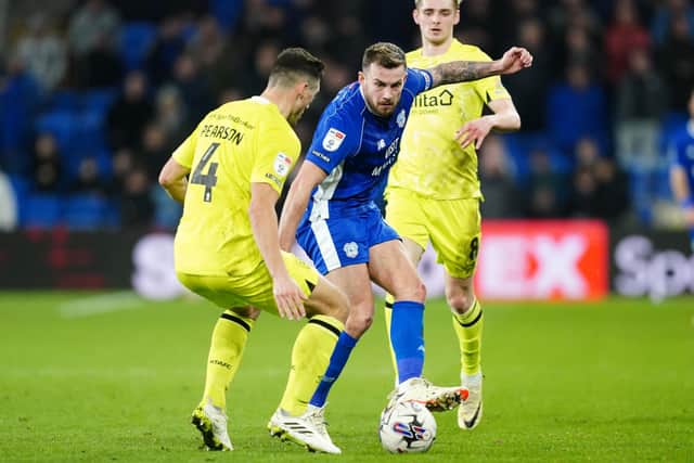 Huddersfield Town's Matty Pearson, left, and Cardiff City's Joe Ralls compete (Picture: David Davies/PA Wire)