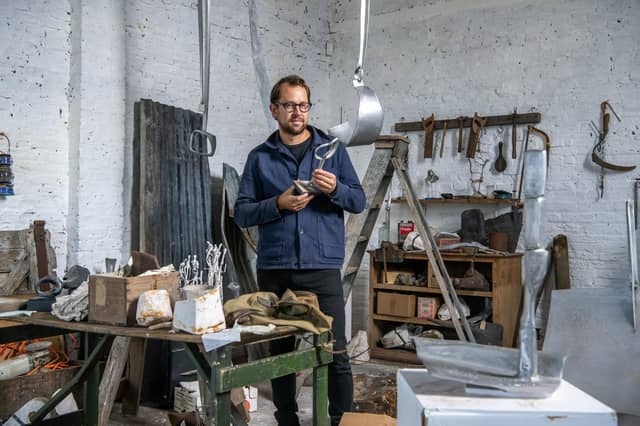 Willoughby Gerrish with the exhibition of sculpture and works on paper by Yorkshire artist Austin Wright in Gallery One at Thirsk Hall Sculpture Garden where his studio has been recreated. Photograph by Tony Johnson.