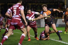 Castleford Tigers' George Lawler in action with Wigan Warriors' Jai Field (Picture: John Clifton/SWPix.com)