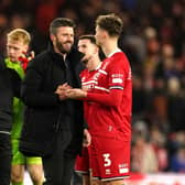 Middlesbrough manager Michael Carrick with Rav van den Berg (right) after the final whistle in the Carabao Cup semi final first leg match against Chelsea at the Riverside Stadium in January. Picture: Martin Rickett/PA Wire.