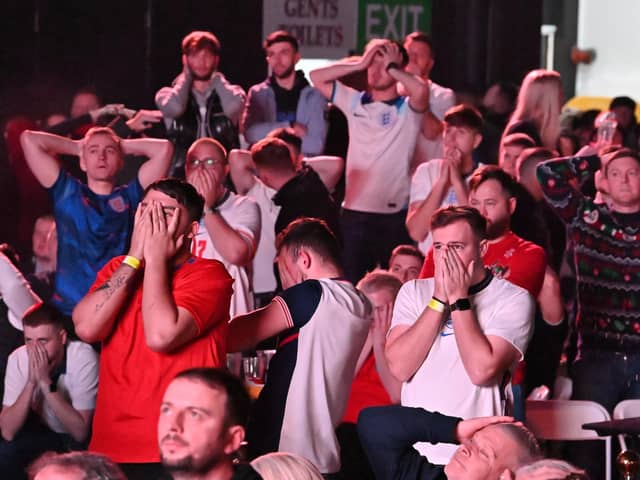 Fans at Winter Gardens Blackpool, reacting to the missed penalty by Harry Kane as they watch a screening of the FIFA World Cup 2022 Quarter Final match between England and France.