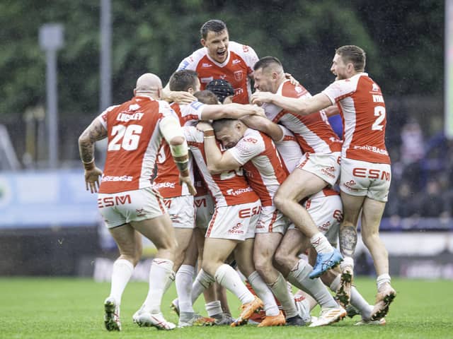 Hull KR celebrate Brad Schneider's game-winning drop goal in golden point against Wigan. (Photo: Allan McKenzie/SWpix.com)