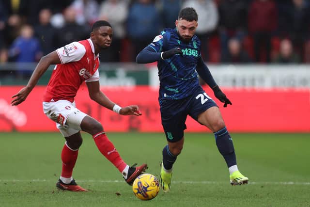Sead Haksabanovic of Stoke City runs past Hakeem Odoffin of Rotherham United during the Sky Bet Championship match at the AESSEAL New York Stadium. Picture: Nathan Stirk/Getty Images.