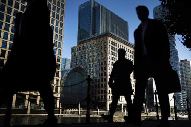 Office workers and commuters walking through Canary Wharf in London during the morning rush hour.  Picture: Victoria Jones/PA Wire