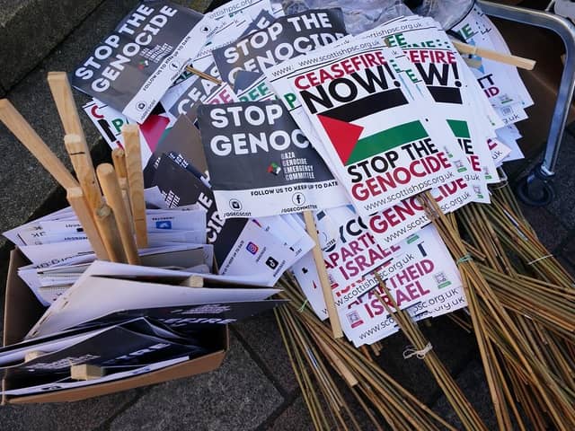 Placards wait to be handout out before people take part in a pro-Palestine rally. PIC: Jane Barlow/PA Wire