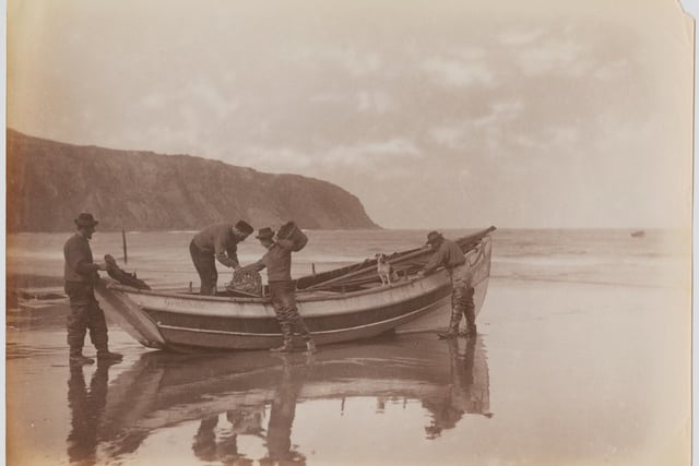 The Storm family of Robin Hood's Bay, Whitby, North Yorkshire, circa 1895. They are Thomas, Reuben, Mathew, Spy the dog and Issac, a farmer who is also cox of the lifeboat. (Photo by Frank Meadow Sutcliffe/Hulton Archive/Getty Images)
