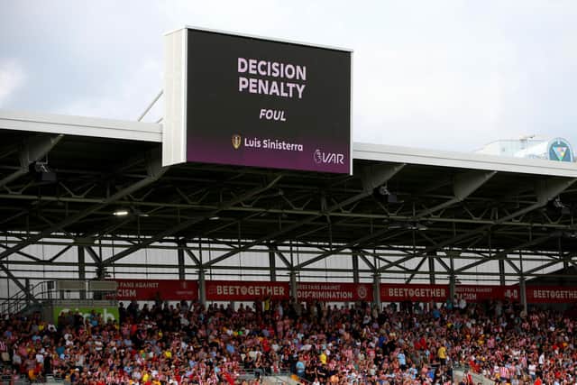 A general view of the LED Screen as it displays 'Decision Penalty' after Brentford are awarded a penalty following a VAR review during the Premier League match between Brentford FC and Leeds United at Brentford Community Stadium. Picture: Steve Bardens/Getty Images.