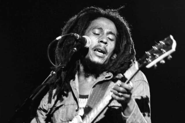 Jamaican reggae singer Bob Marley performs in front of an audience of 40,000 during a concert in Paris in 1980. (AP File Photo)