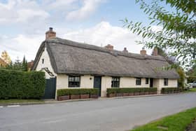 The thatched cottage is full of character inside and out