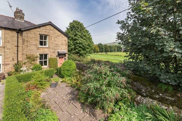 The three-bedroom, extended cottage is in an enviable location in the sought-after village of Settle.