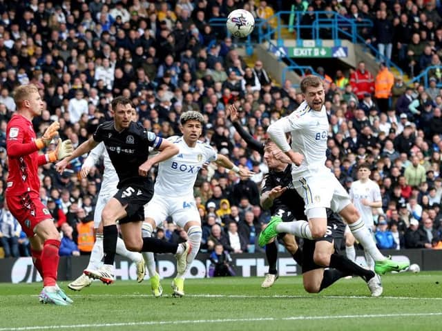 CHANCE: Patrick Bamford of Leeds United heads wide under pressure from Kyle McFadzean