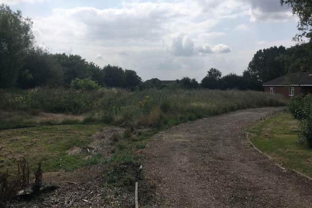 The site is a bungalow set in large gardens off Welton Road