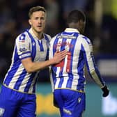 Sheffield Wednesday midfielder Will Vaulks hands a pat on the back to winger Djeidi Gassama during the recent Championship home game against Plymouth Argyle.