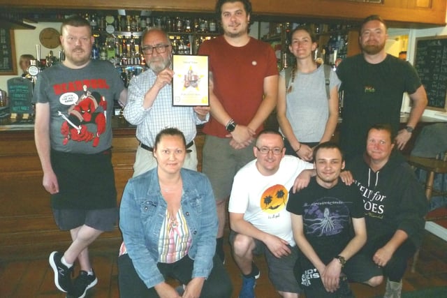 Glyn Mansell, chairman of CAMRA, presenting the Pub of the Year 2019 award for Sheffield South to manager Josh Hayton and staff of the Sheaf View at Heeley. The pub also won the same award in 2020