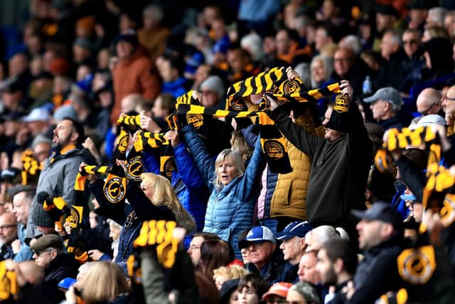 SHEFFIELD, ENGLAND - OCTOBER 04: Fans of Sheffield Wednesday hold up scarves in protest of Dejphon Chansiri, Owner of Sheffield Wednesday, during the Sky Bet Championship match between Sheffield Wednesday and Coventry City at Hillsborough on October 04, 2025 in Sheffield, England. (Photo by Jess Hornby/Getty Images)