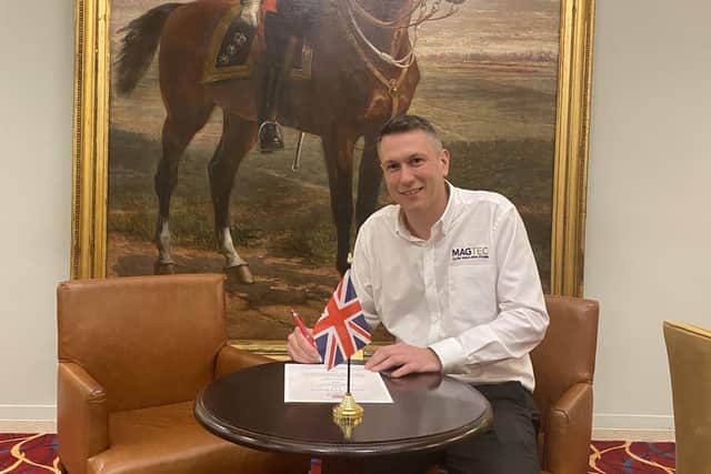 After leaving the Royal Navy in 2014, Andrew Sloan made the difficult transition into civilian life. Image: Andrew signs the armed forces covenant on behalf of Magtec at the Union Jack Club.