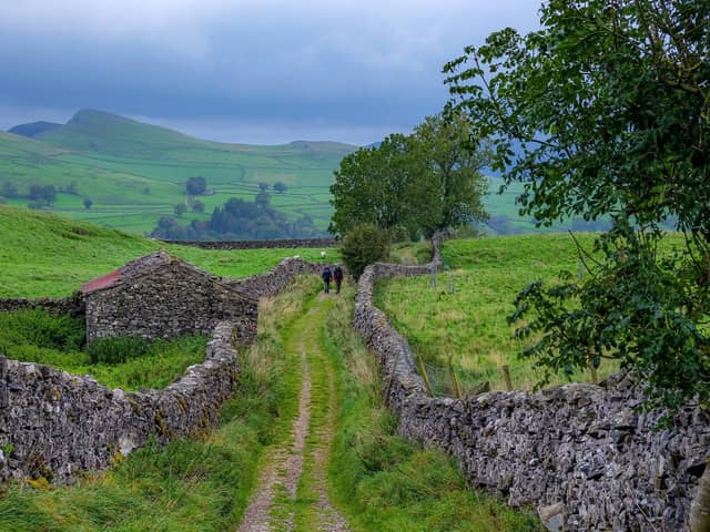 Ramblers make their way along the footpath towards the village of Stainforth nestled in Ribblesdale near Settle in the Yorkshire Dales National Park. PIC: Tony Johnson