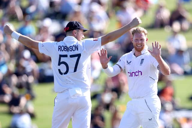 TAURANGA, NEW ZEALAND - FEBRUARY 17: Ben Stokes of England celebrates his wicked of Devon Conway of New Zealand with Ollie Robinson during day two of the First Test match in the series between the New Zealand Blackcaps and England at the Bay Oval on February 17, 2023 in Mount Maunganui, New Zealand. (Photo by Phil Walter/Getty Images)