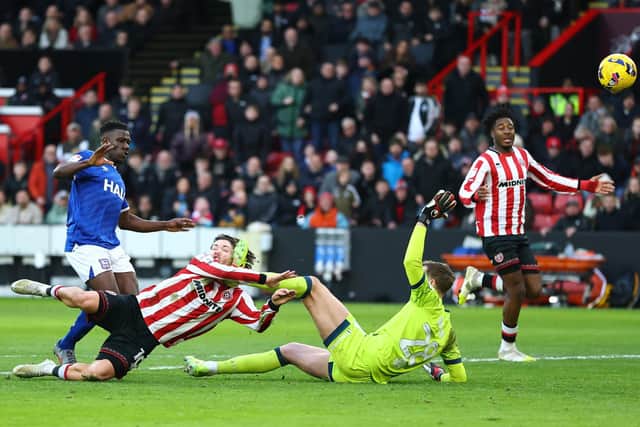 CRUNCH TIME: Christian Walton's boots smashes into Callum O'Hare as the Sheffield United player finds the net (Image: Simon Bellis / Sportimage)