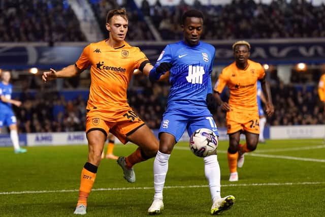 TOUGH GOING: Birmingham City's Siriki Dembele and Hull City's Scott Twine battle for the ball at St. Andrew's. Picture: Jacob King/PA