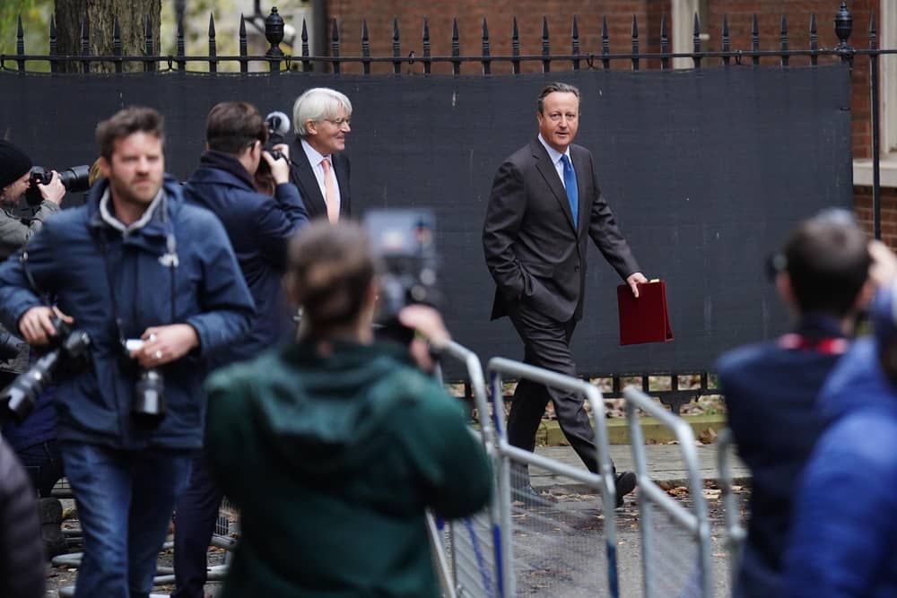 Members of the media photograph Foreign Secretary Lord David Cameron (right) and Minister for Development in the Foreign Office Andrew Mitchell arriving in Downing Street. PIC: James Manning/PA Wire