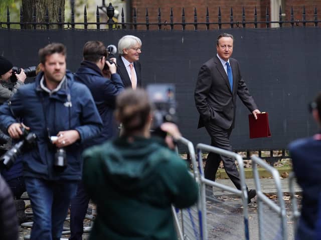 Members of the media photograph Foreign Secretary Lord David Cameron (right) and Minister for Development in the Foreign Office Andrew Mitchell arriving in Downing Street. PIC: James Manning/PA Wire