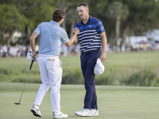 Matt Fitzpatrick, left, of England, shakes hands with Jordan Spieth after winning a three-hole playoff on the 18th green during the final round of the RBC Heritage golf tournament, Sunday, April 16, 2023, in Hilton Head Island, S.C. (AP Photo/Stephen B. Morton)