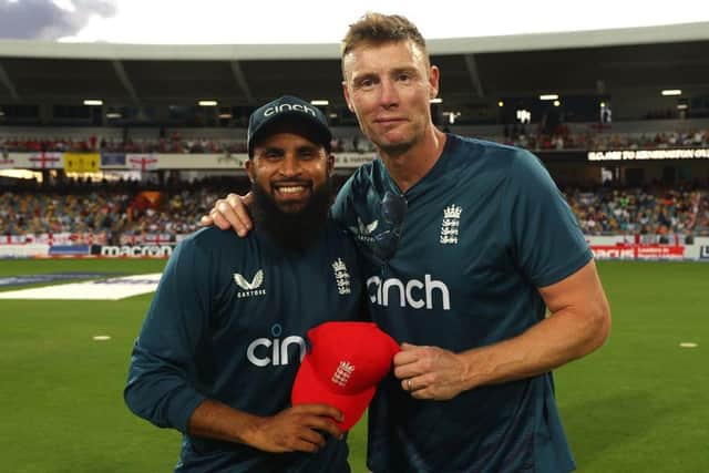 Adil Rashid of England is awarded his 100th T20 International cap by former England Cricketer Andrew Flintoff during the 1st T20 International between West Indies and England at Kensington Oval on December 12, 2023 in Bridgetown, Barbados. (Photo by Ashley Allen/Getty Images)