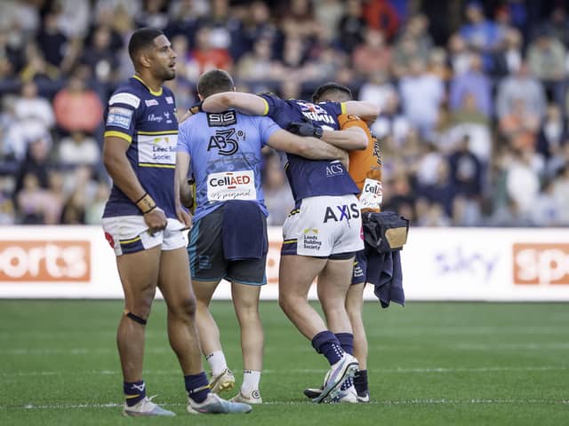 Harry Newman is helped from the field after suffering an injury against St Helens. (Photo: Allan McKenzie/SWpix.com)
